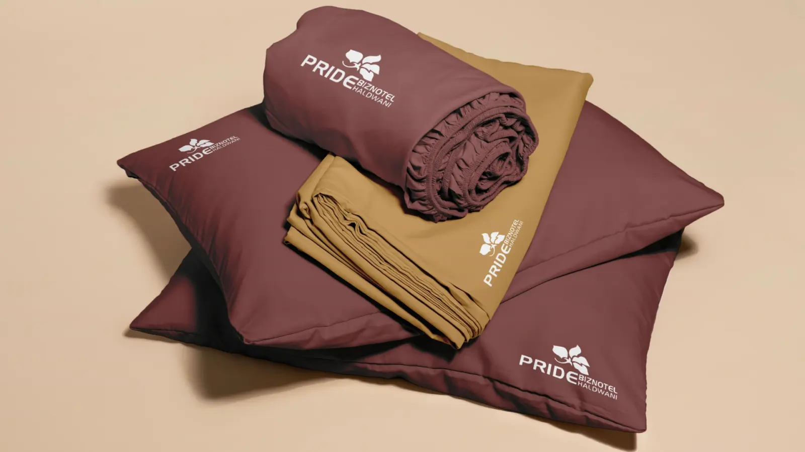 Pride Biznotel brand identity: maroon and gold pillows and linen with the hotel logo